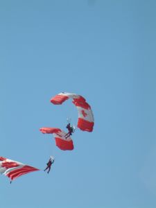 Three of the Canadian Skydiving Team performing