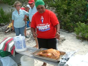 Miss Maxine prepares to carve the turkey